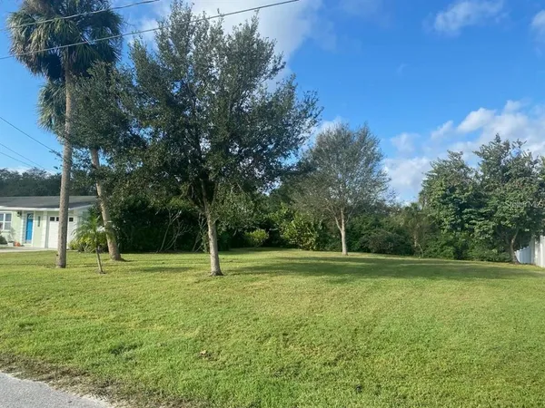 a view of outdoor space with deck and yard