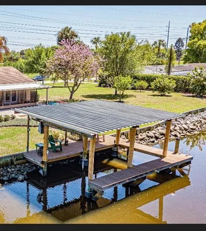 a view of a swimming pool with a patio