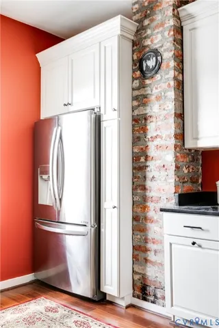 a refrigerator freezer sitting inside of a kitchen