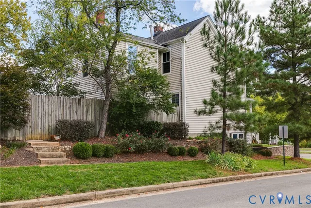 a view of a house with a yard and plants