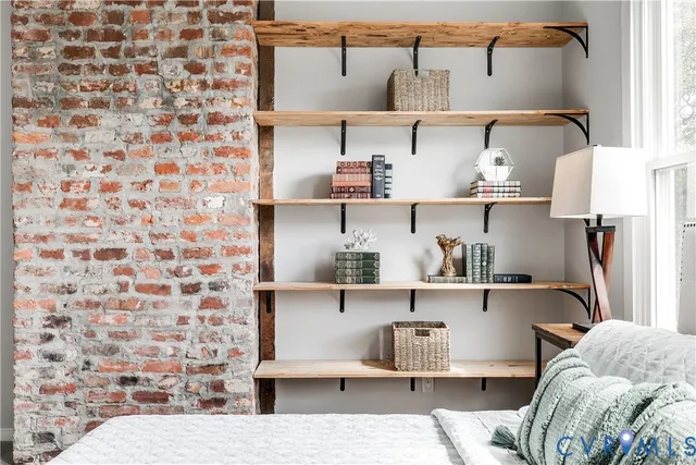 a view of living room with furniture and lamp