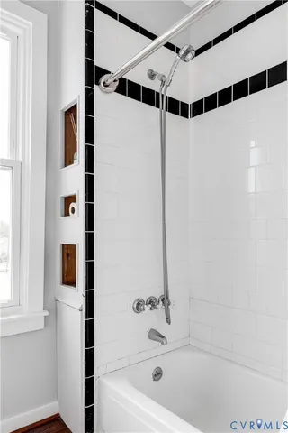 a bathroom with a shower and a tub