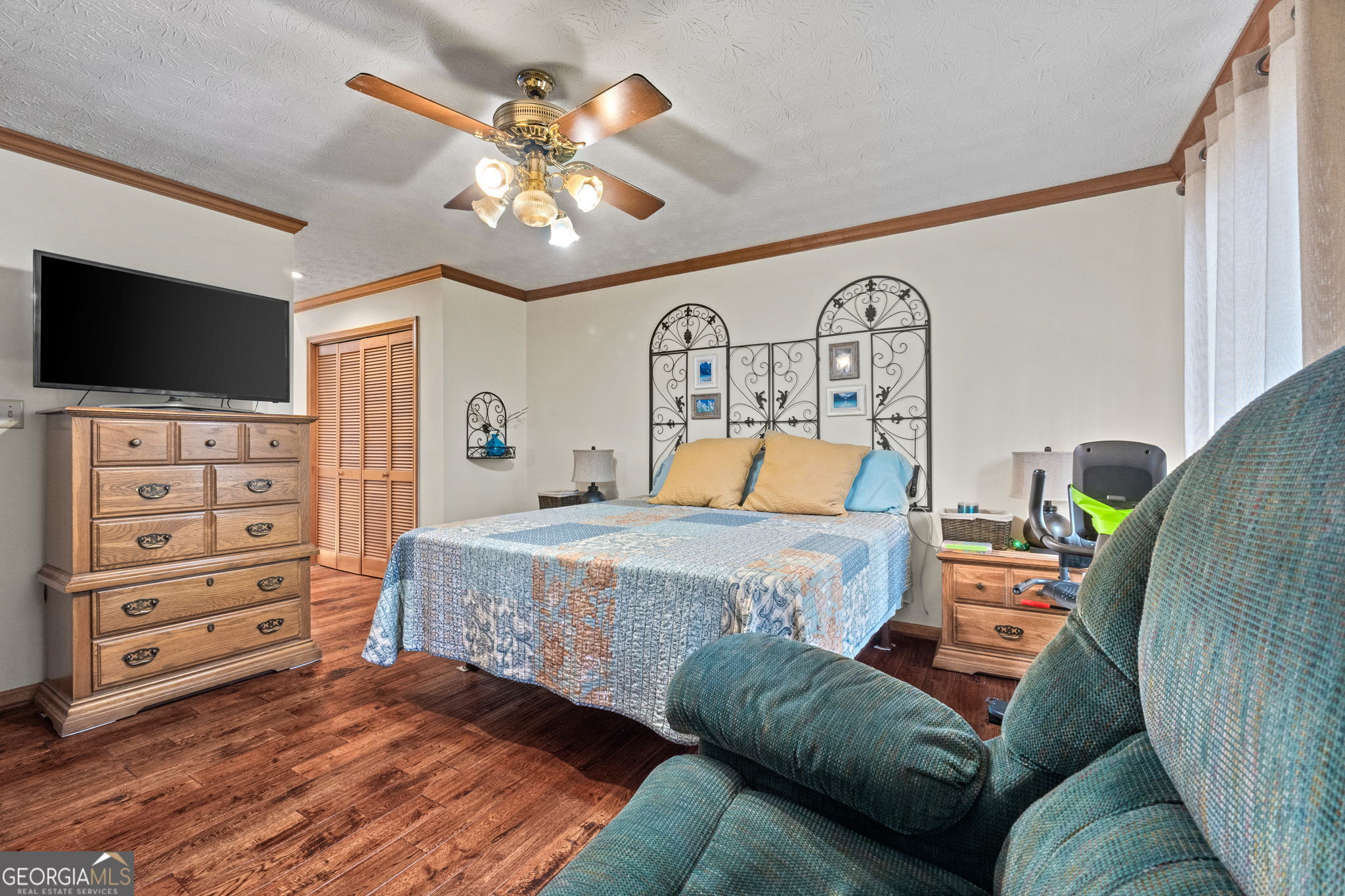 110 The Farm Road McDonough, GA 30252 - Photo 14 of 32 a bedroom with a bed and flat screen tv