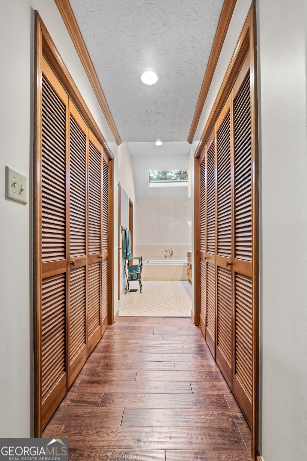 110 The Farm Road McDonough, GA 30252 - Photo 16 of 32 a view of a hallway with wooden floor