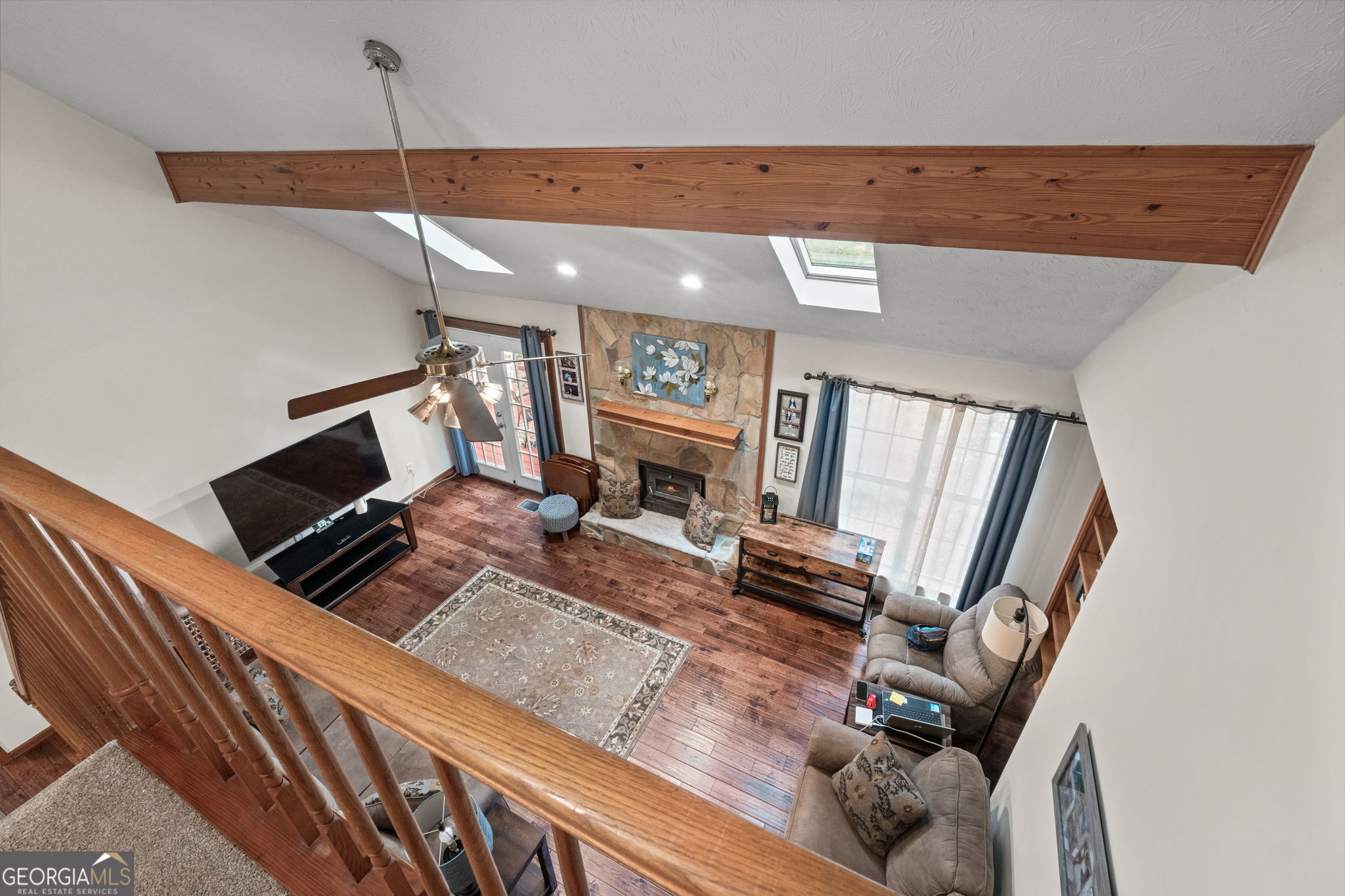 110 The Farm Road McDonough, GA 30252 - Photo 19 of 32 wooden floor with fireplace and window
