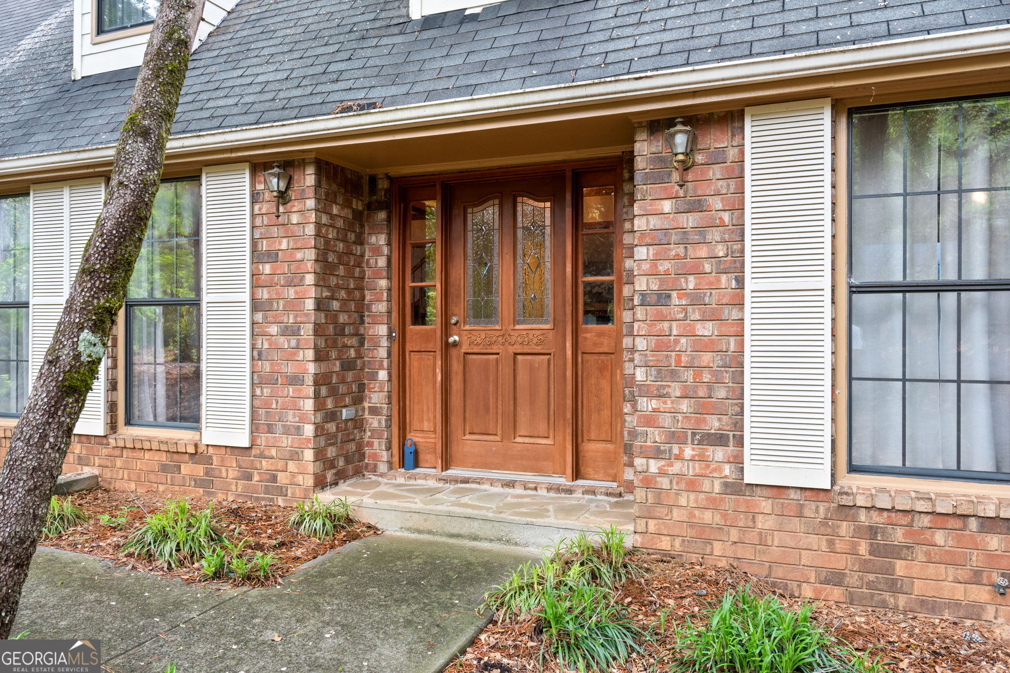 110 The Farm Road McDonough, GA 30252 - Photo 2 of 32 a front view of a house with a garden