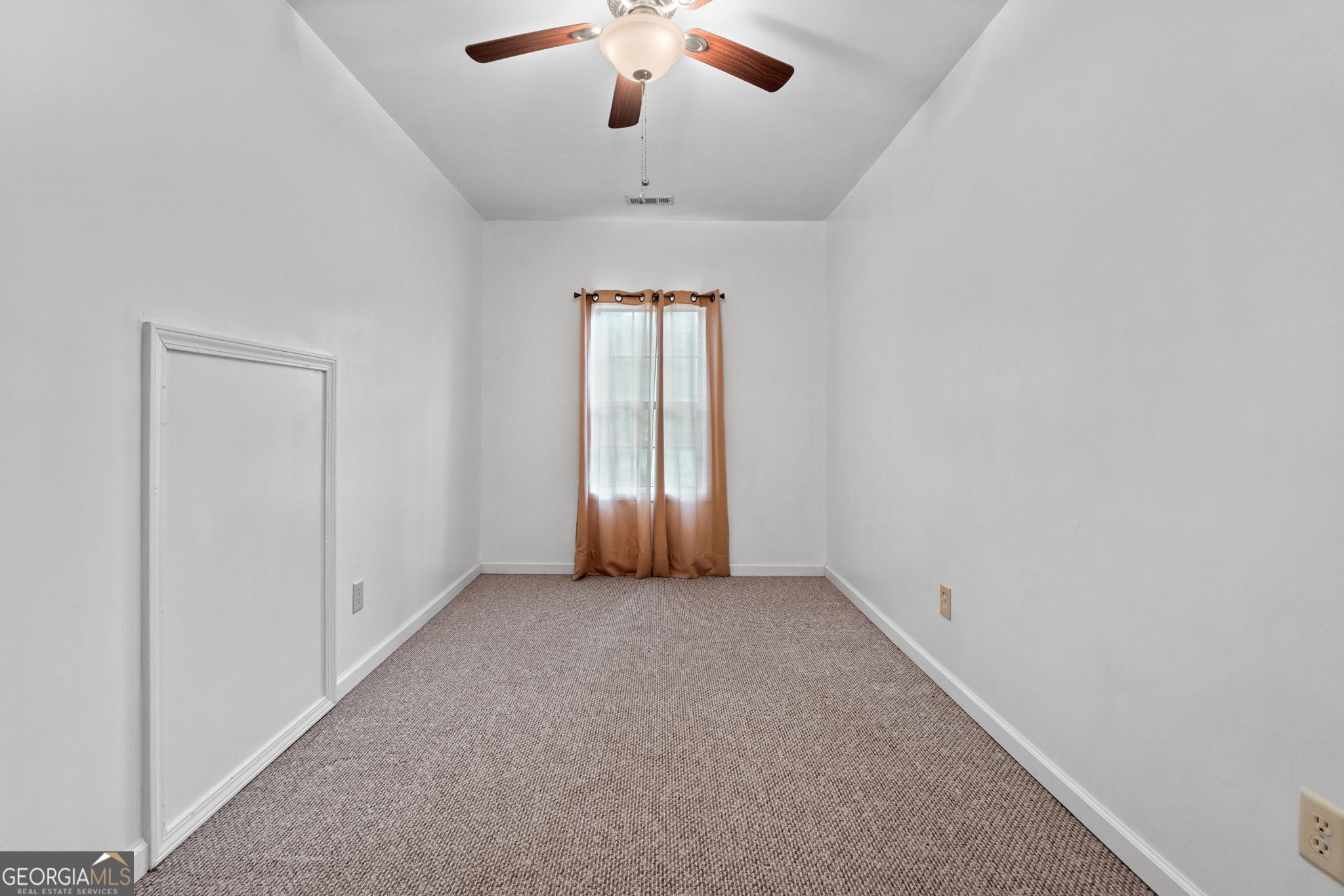 110 The Farm Road McDonough, GA 30252 - Photo 23 of 32 an empty room with a chandelier fan and windows