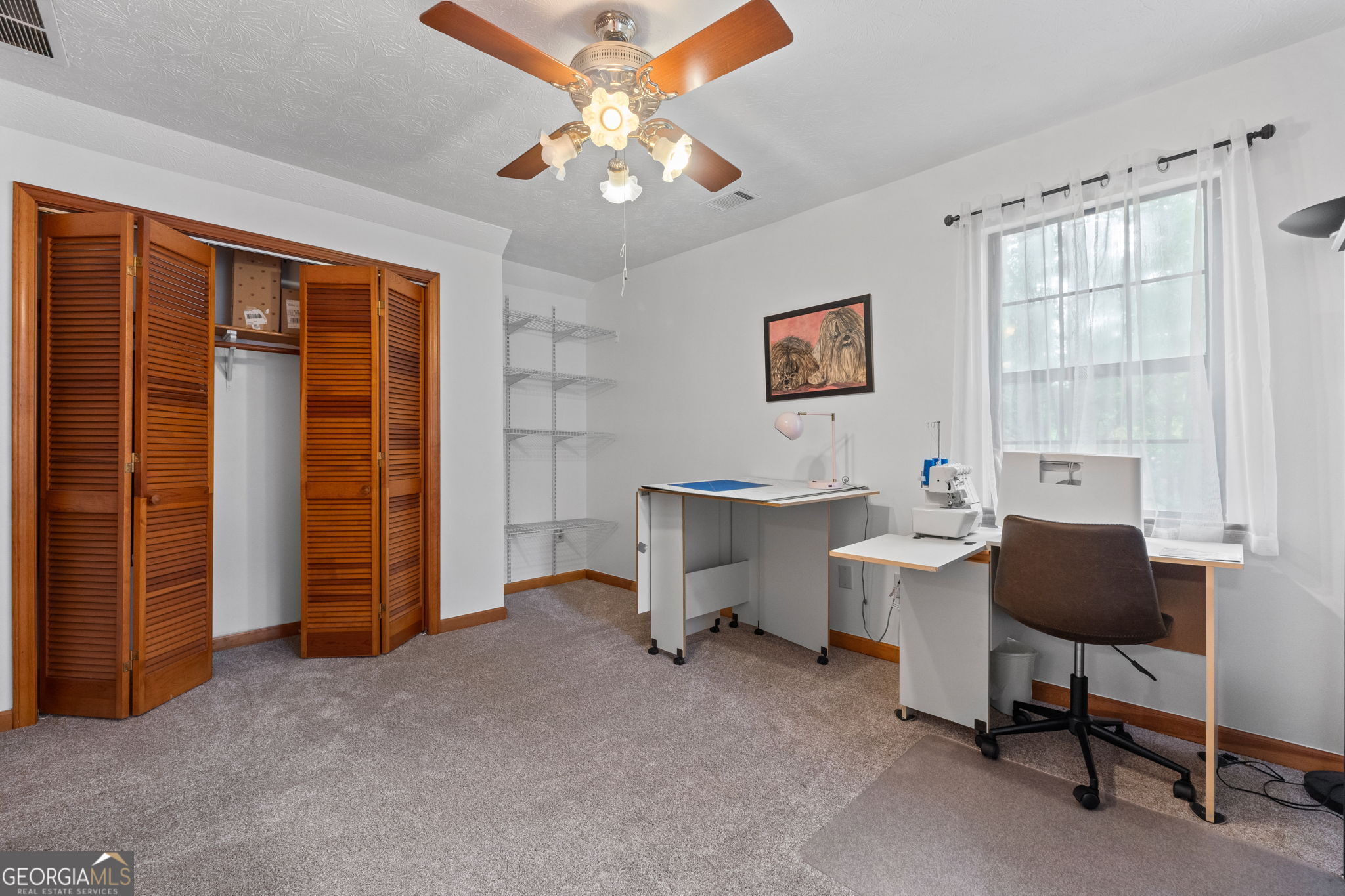 110 The Farm Road McDonough, GA 30252 - Photo 26 of 32 a living room with furniture a desk and chair