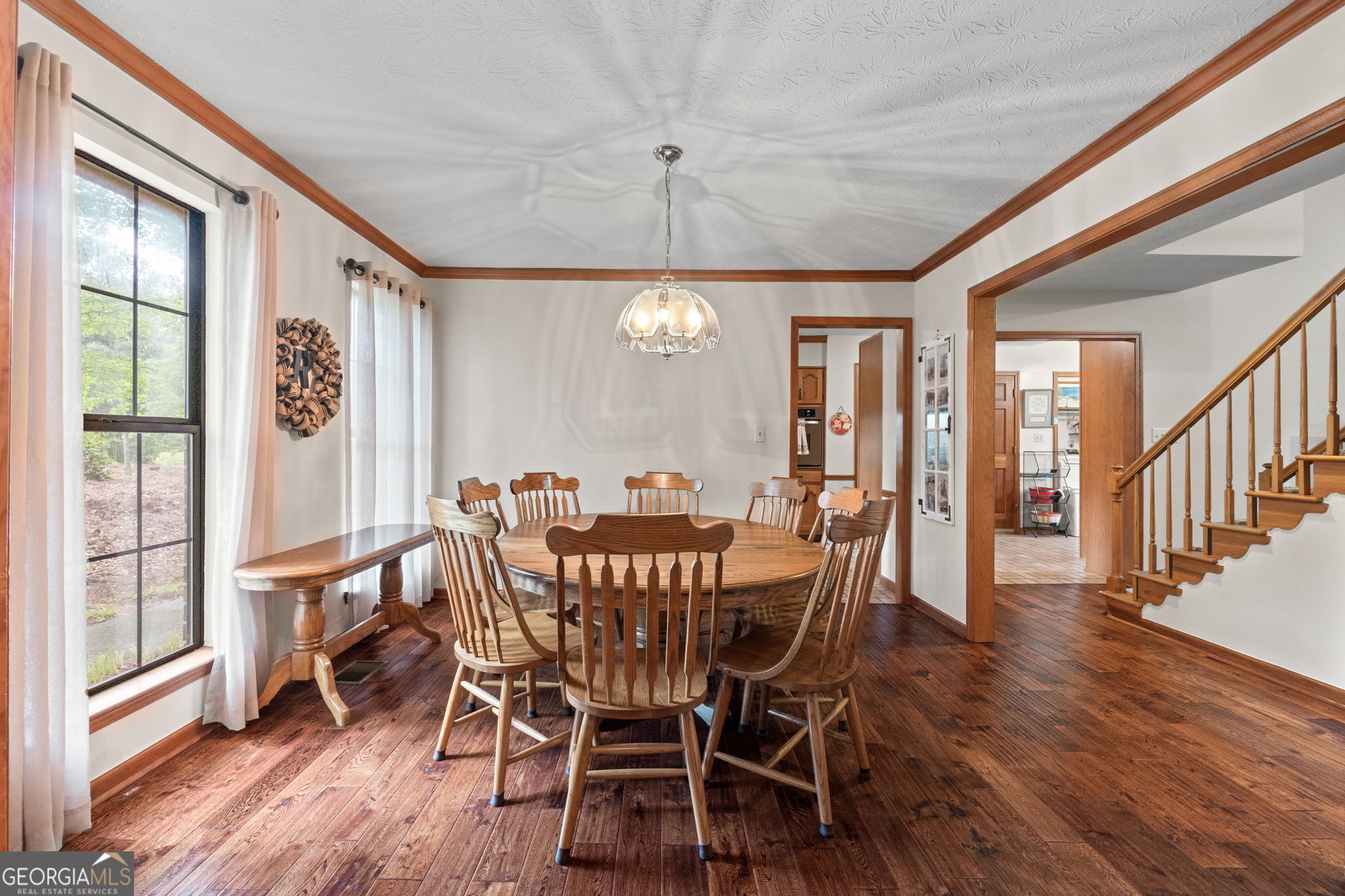 110 The Farm Road McDonough, GA 30252 - Photo 4 of 32 a view of a dining room with furniture window and wooden floor
