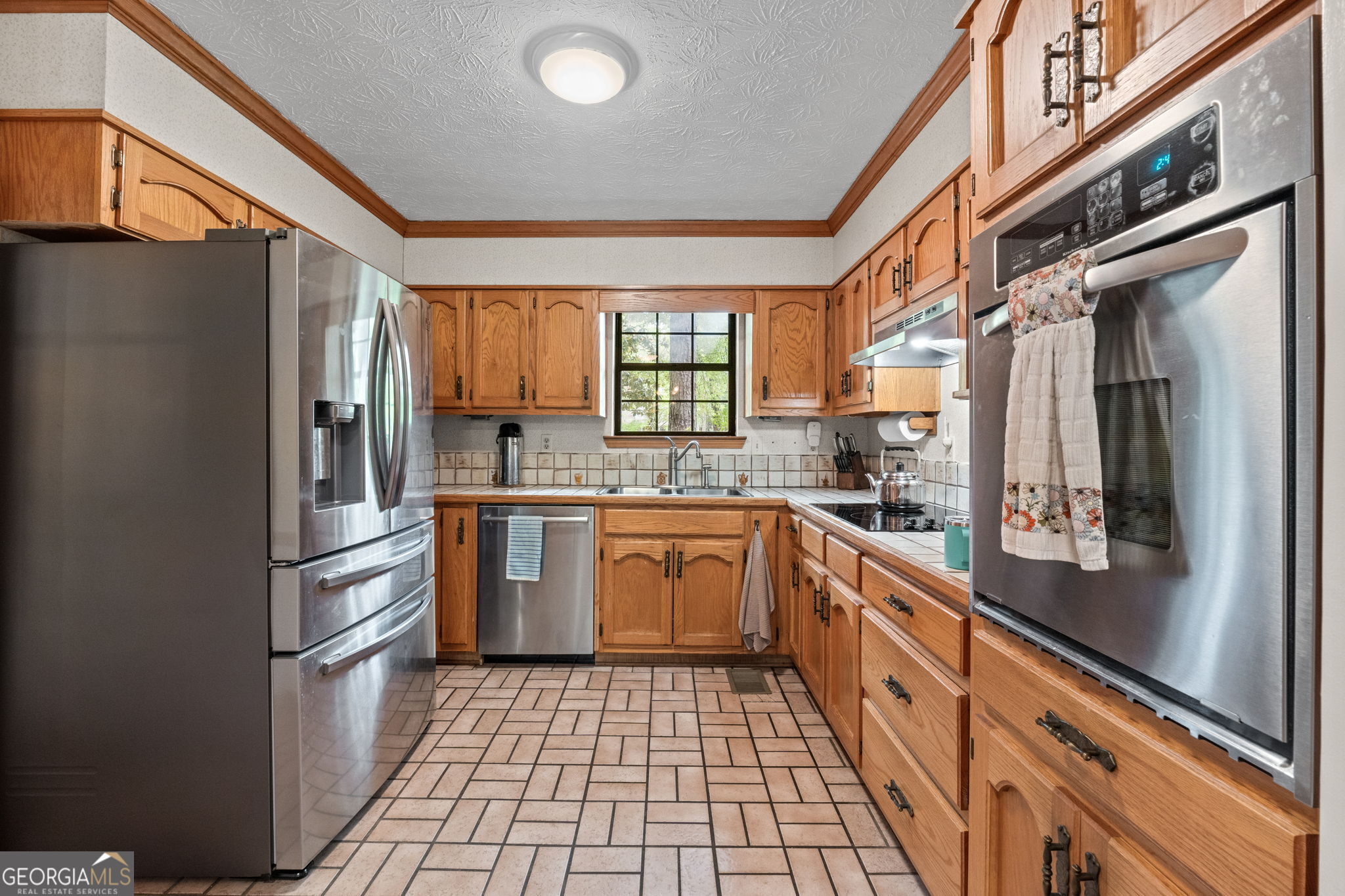 110 The Farm Road McDonough, GA 30252 - Photo 9 of 32 a kitchen with stainless steel appliances granite countertop a refrigerator and a stove