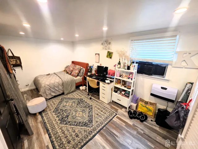 a living room with lots of furniture and a flat screen tv