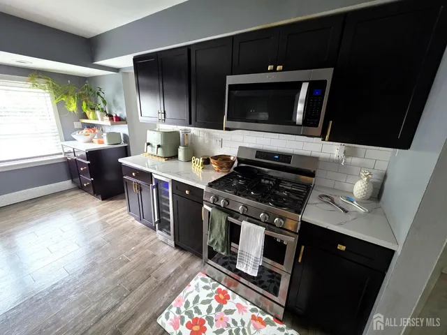 a kitchen with a stove and a microwave