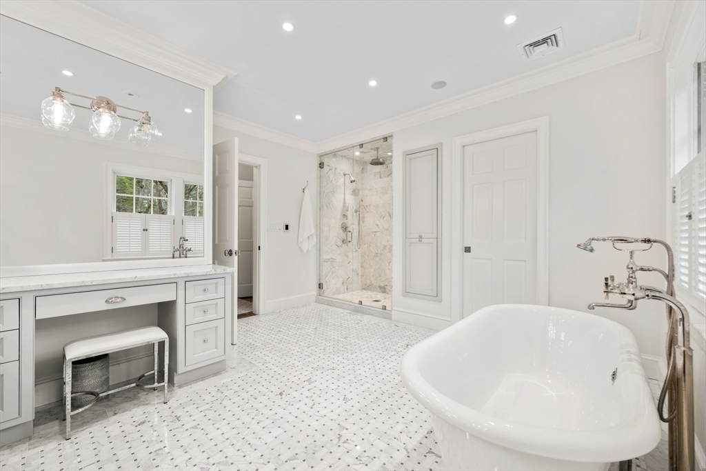 8 Glen Brook Road Wellesley, MA 02481 - Photo 17 of 32 a en suite bathroom with a bathtub shower sink and mirror