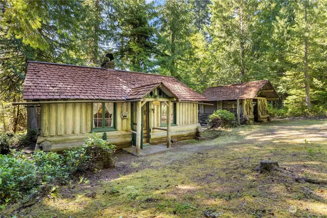 a view of a house with a yard porch and furniture