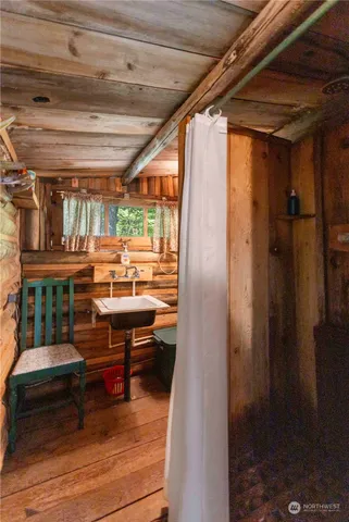 a backyard of a house with barbeque oven table and chairs