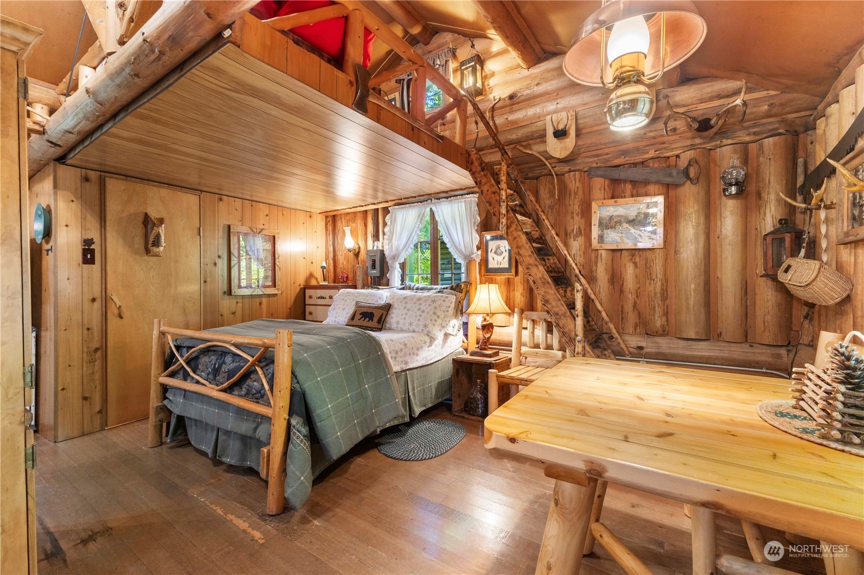 9 The Dalles Enumclaw, WA 98022 - Photo 6 of 21 a spacious bedroom with a bed and a chandelier