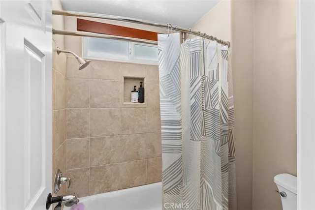 a bathroom with a shower and a tub