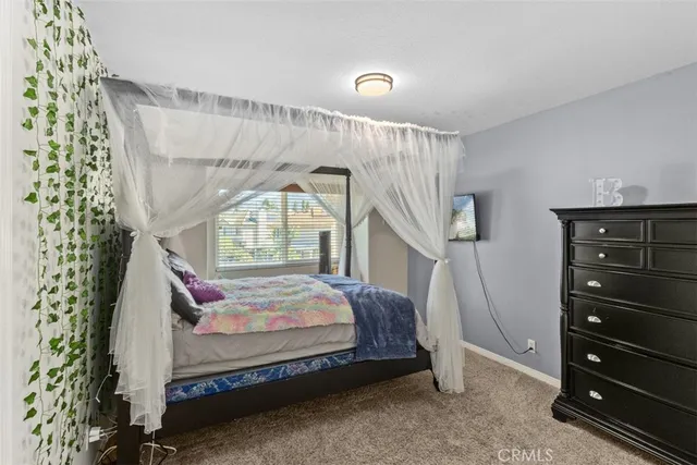 a bed room with a bed and a window