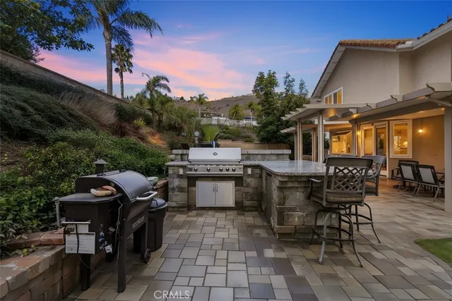 a patio with table and chairs