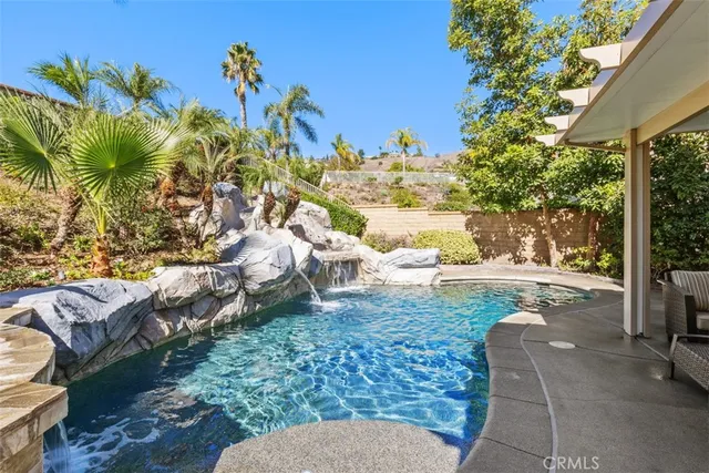 a view of a yard with an outdoor seating