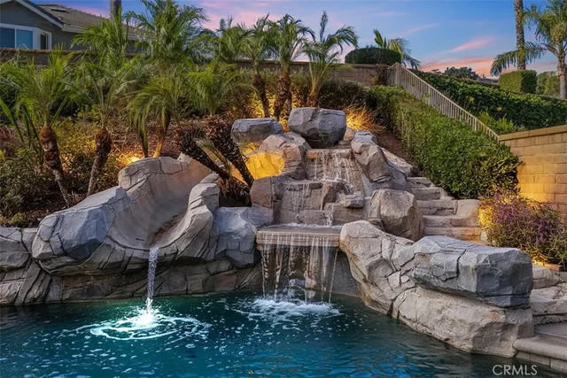 a view of a house with backyard porch and sitting area