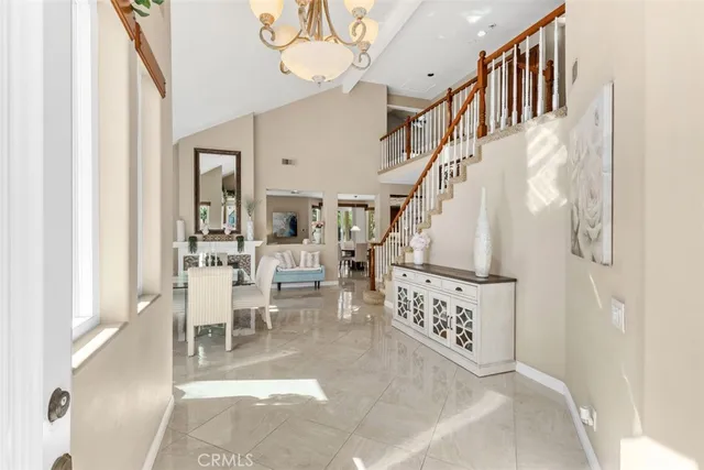 a view of living room with furniture and a chandelier