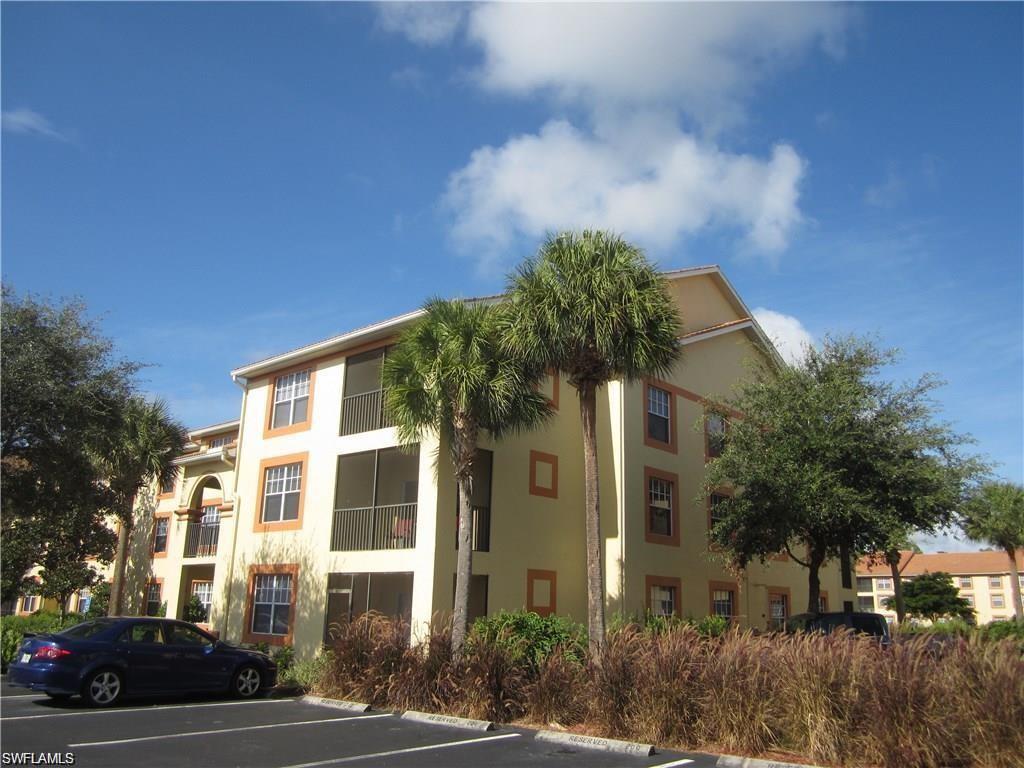 7985 Preserve Circle, Unit 1132 Naples, FL 34119 - Photo 1 of 2 a front view of a house with a yard