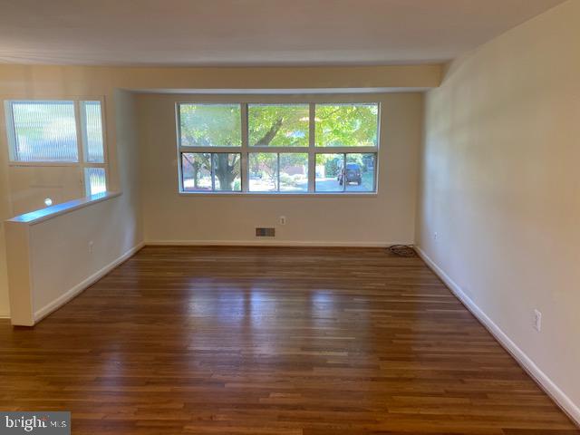 923 Malta Lane Silver Spring, MD 20901 - Photo 5 of 33 Living room with re-finished hardwood flooring