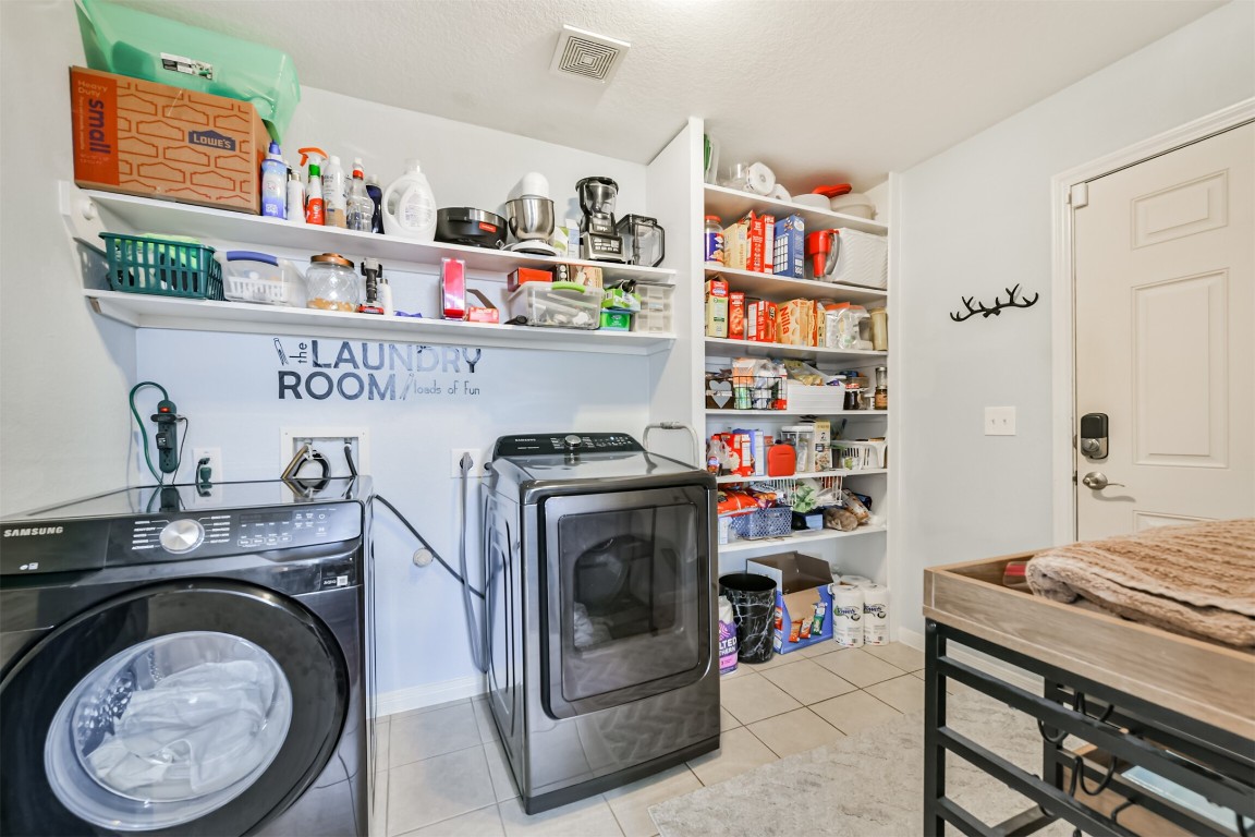 448 7th Street Dickinson, TX 77539 - Photo 18 of 32 Laundry room with extra storage