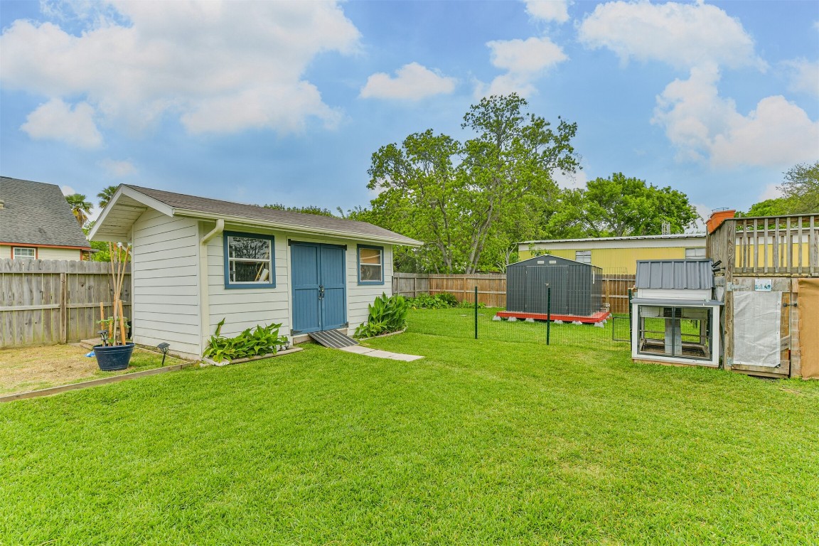 448 7th Street Dickinson, TX 77539 - Photo 25 of 32 outdoor shop, storage building and Chickens and Chicken coop for fresh eggs.