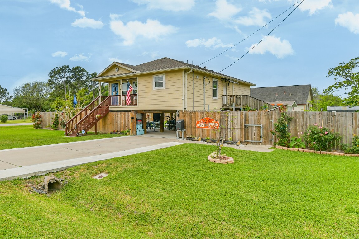 448 7th Street Dickinson, TX 77539 - Photo 7 of 32 Extra long driveway with electric gate.