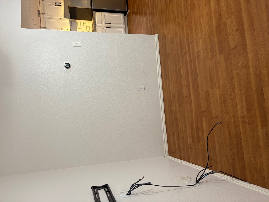 701 Nelray Boulevard, Unit 4 Austin, TX 78751 - Photo 2 of 10 a view of empty room with wooden floor and fan