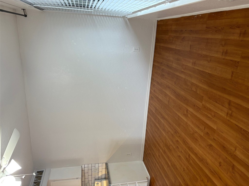 701 Nelray Boulevard, Unit 4 Austin, TX 78751 - Photo 3 of 10 a view of empty room with wooden floor and fan