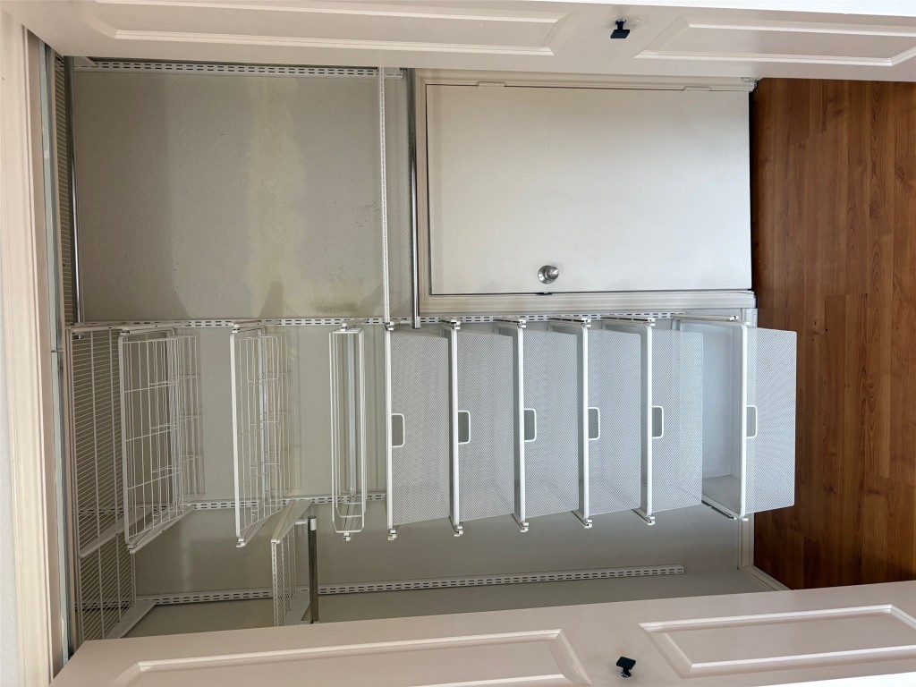 701 Nelray Boulevard, Unit 4 Austin, TX 78751 - Photo 7 of 10 a view of walk in closet with empty racks