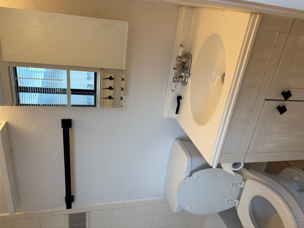 701 Nelray Boulevard, Unit 4 Austin, TX 78751 - Photo 8 of 10 a bathroom with a sink and a toilet