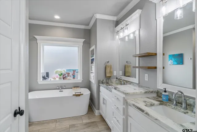 a kitchen with stainless steel appliances granite countertop a refrigerator and a stove