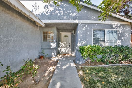 528 South Sorrel Street Ridgecrest, CA 93555 - Photo 2 of 27 a front view of a house with a yard