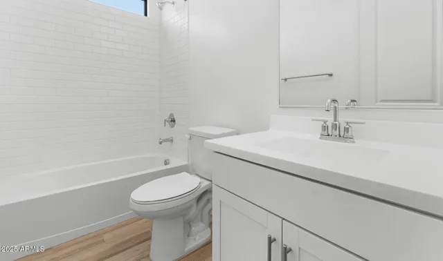 a bathroom with a sink a toilet and a bathtub