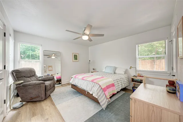 a bedroom with a bed furniture and a window