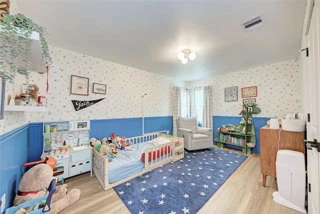 a bedroom with furniture and a couch