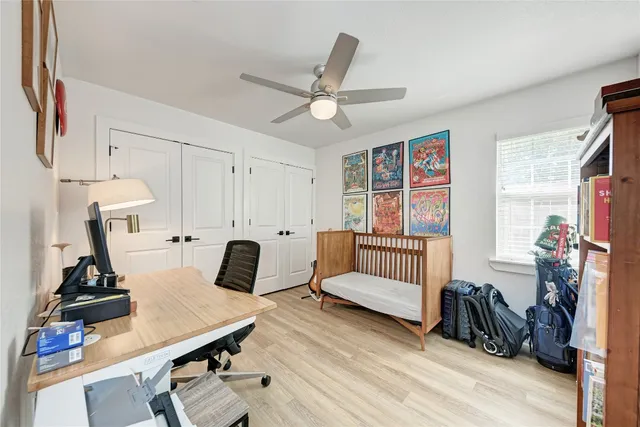 a bedroom with furniture and a window