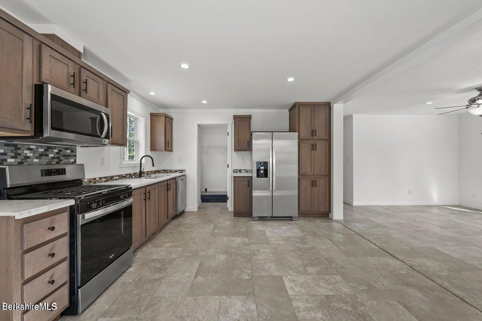 395 Cheshire Road, Unit 121 Pittsfield, MA 01201 - Photo 3 of 11 Kitchen to Living Rm