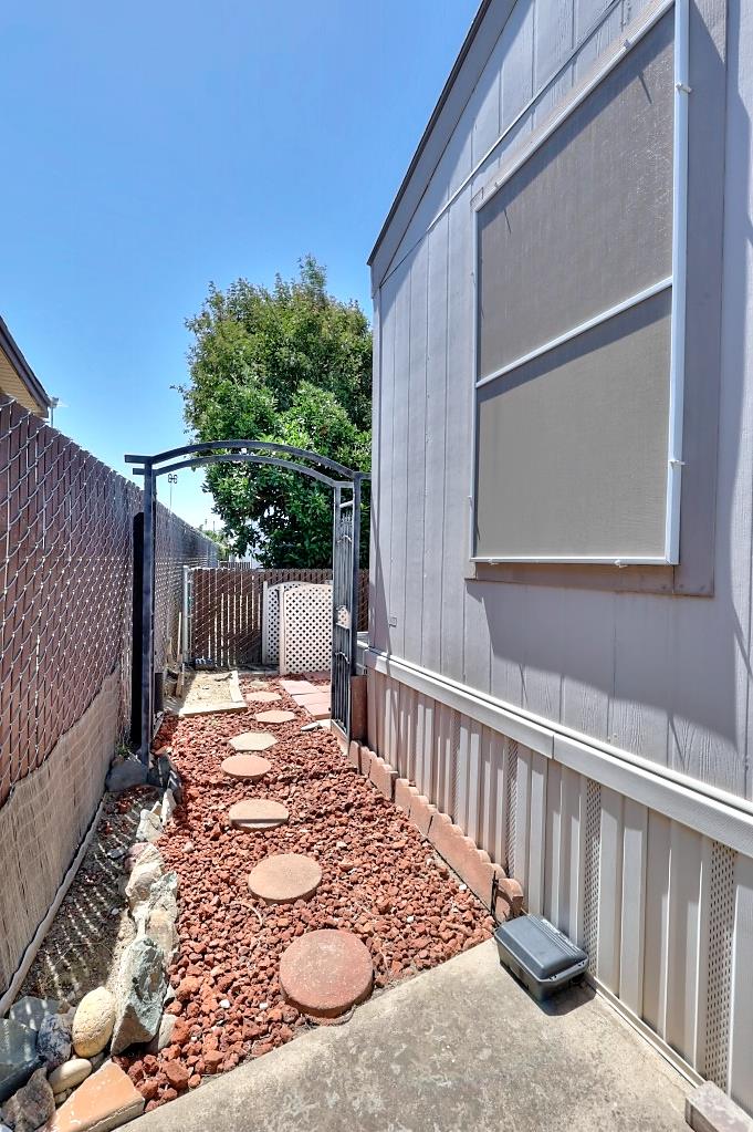 3506 Homestead Way Ceres, CA 95307 - Photo 29 of 39 a view of a backyard with a small cabin