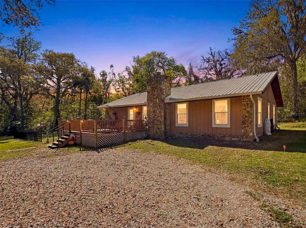 24350 Lanark Road Brooksville, FL 34601 - Photo 33 of 56 a view of a house with a yard
