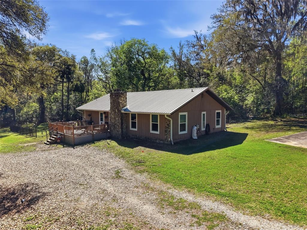 24350 Lanark Road Brooksville, FL 34601 - Photo 34 of 56 a front view of a house with yard and green space