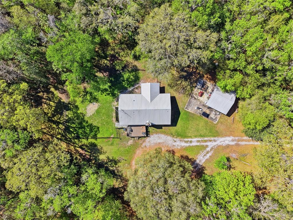 24350 Lanark Road Brooksville, FL 34601 - Photo 37 of 56 an aerial view of a house with a yard