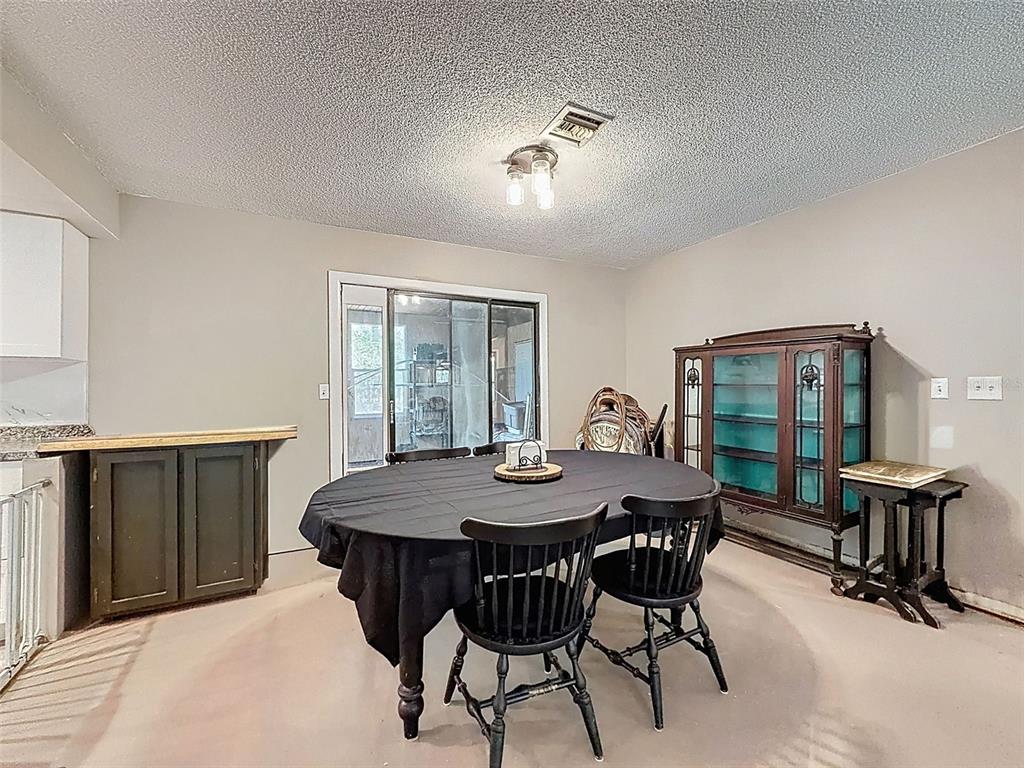 24350 Lanark Road Brooksville, FL 34601 - Photo 10 of 56 a dining room with furniture and window