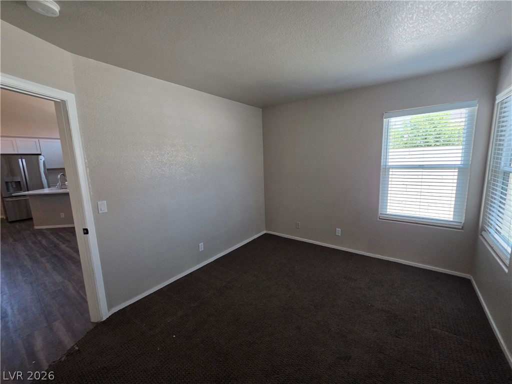 2275 Ramsgate Drive Henderson, NV 89074 - Photo 79 of 84 A versatile space features soft carpeting and ample natural light from two windows.