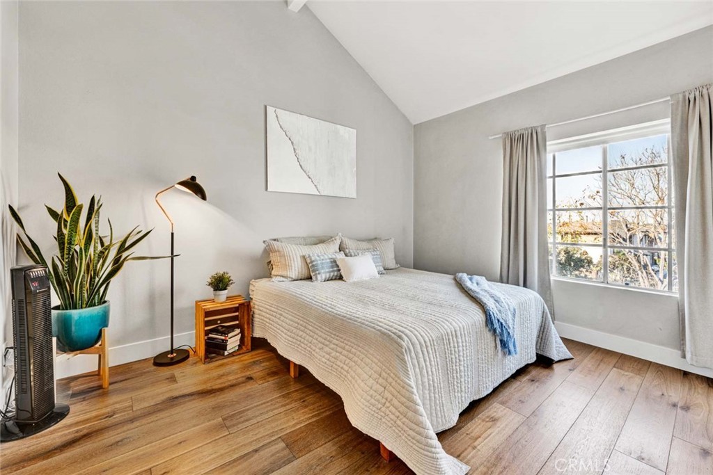 789 Grayling Bay Costa Mesa, CA 92626 - Photo 20 of 42 a bedroom with a bed table flowerpot and window