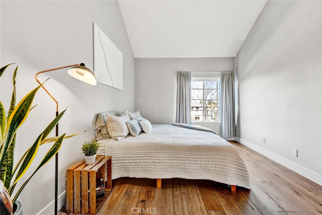 789 Grayling Bay Costa Mesa, CA 92626 - Photo 21 of 42 a bedroom with a bed and wooden floor